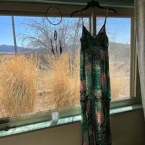 Beautiful peasant style maxi dress. Worn once! Adjustable straps.  Ties in back.